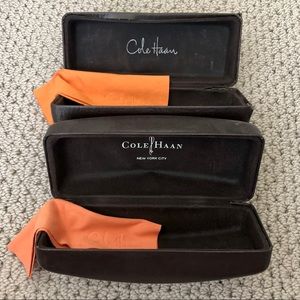 Two Cole Haan sunglasses cases